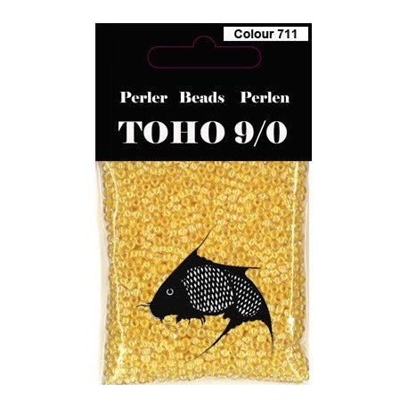 TOHO perler 9/0 farvenr 711 lys gul, farvet kerne klar udenom. 40g